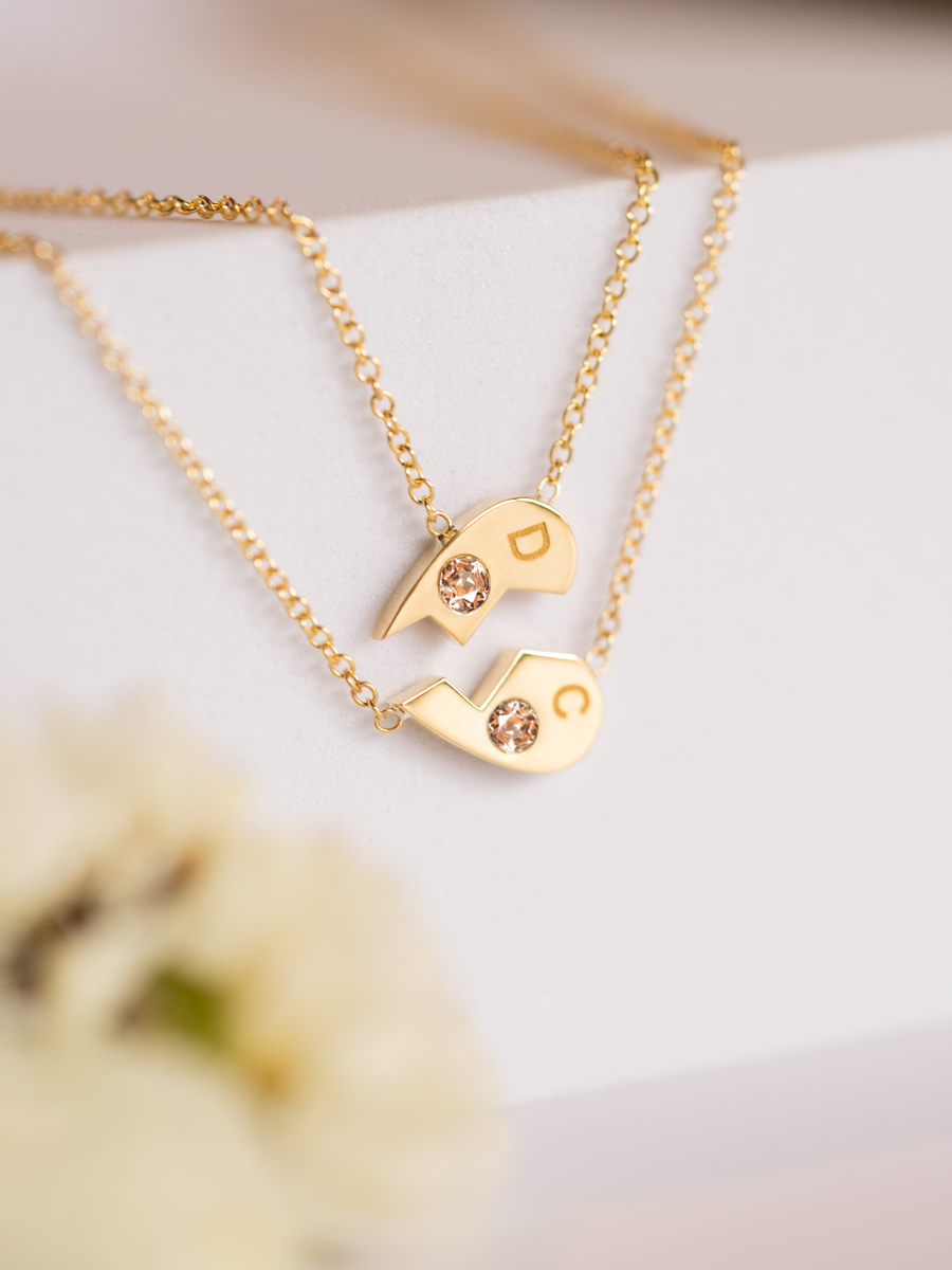 18k gold and sapphire half heart necklace set.