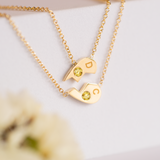 18k gold and sapphire half heart necklace set.