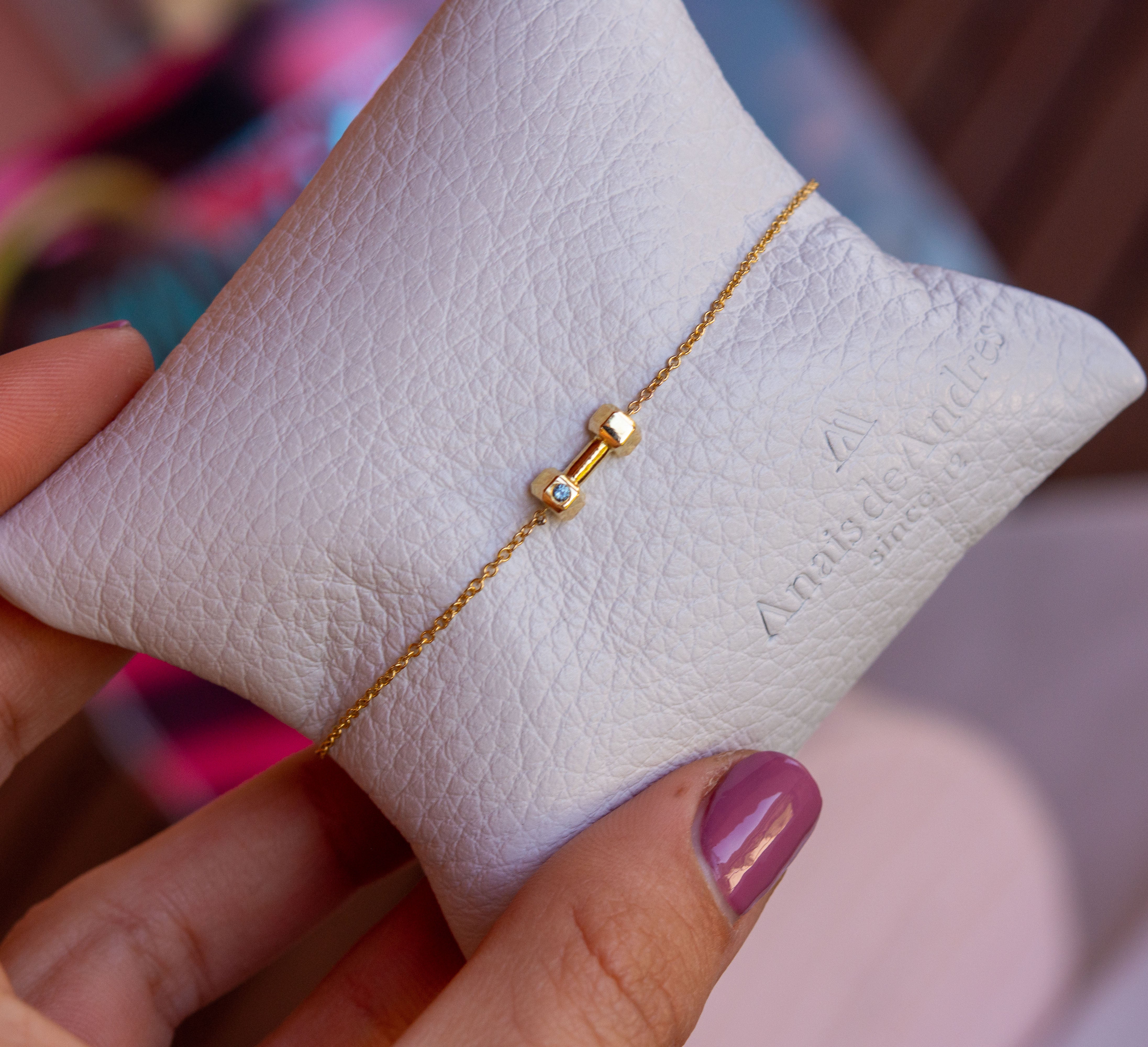 18k gold dumbbell bracelet.