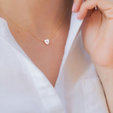 18k gold heart necklace.
